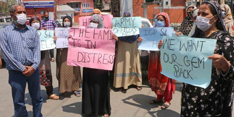 Missing Bemina scholar’s family protest to seek his whereabouts
